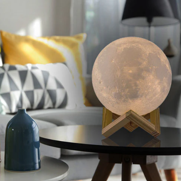 a moon lamp on a table