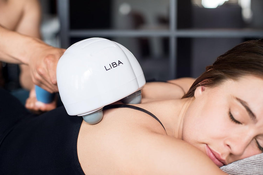 a person receiving a massage with text: 'LIBA'