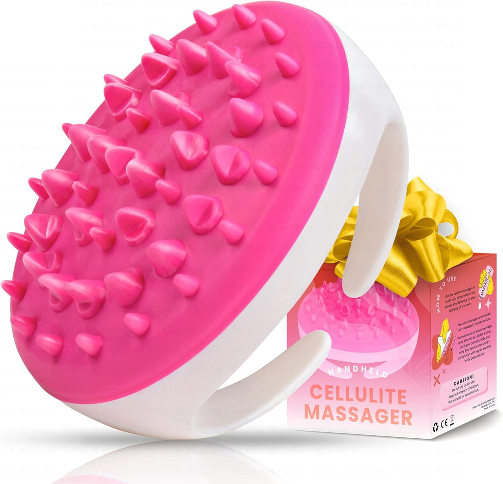 a pink and white massager with a box with text: 'O USE MOH Use the massager on skin, either in the shower after or after HANDHELD Press the massager onto the skin CELLULITE and massage in circular motions. You may focus on areas more to be by such as and MASSAGER the buttocks, and arms. Best results when used in with regular exercise and a balanced CAUTION! Do not use on dry skin. Keep out of reach of Not suitable for sensitive'