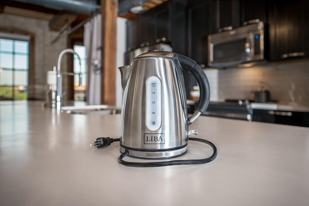 a silver and black kettle on a counter with text: '1.5L 0.8L LIBA'