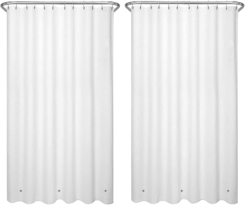 a pair of white shower curtains