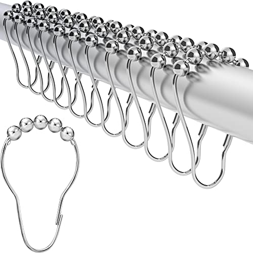 a group of metal hooks with balls attached to them