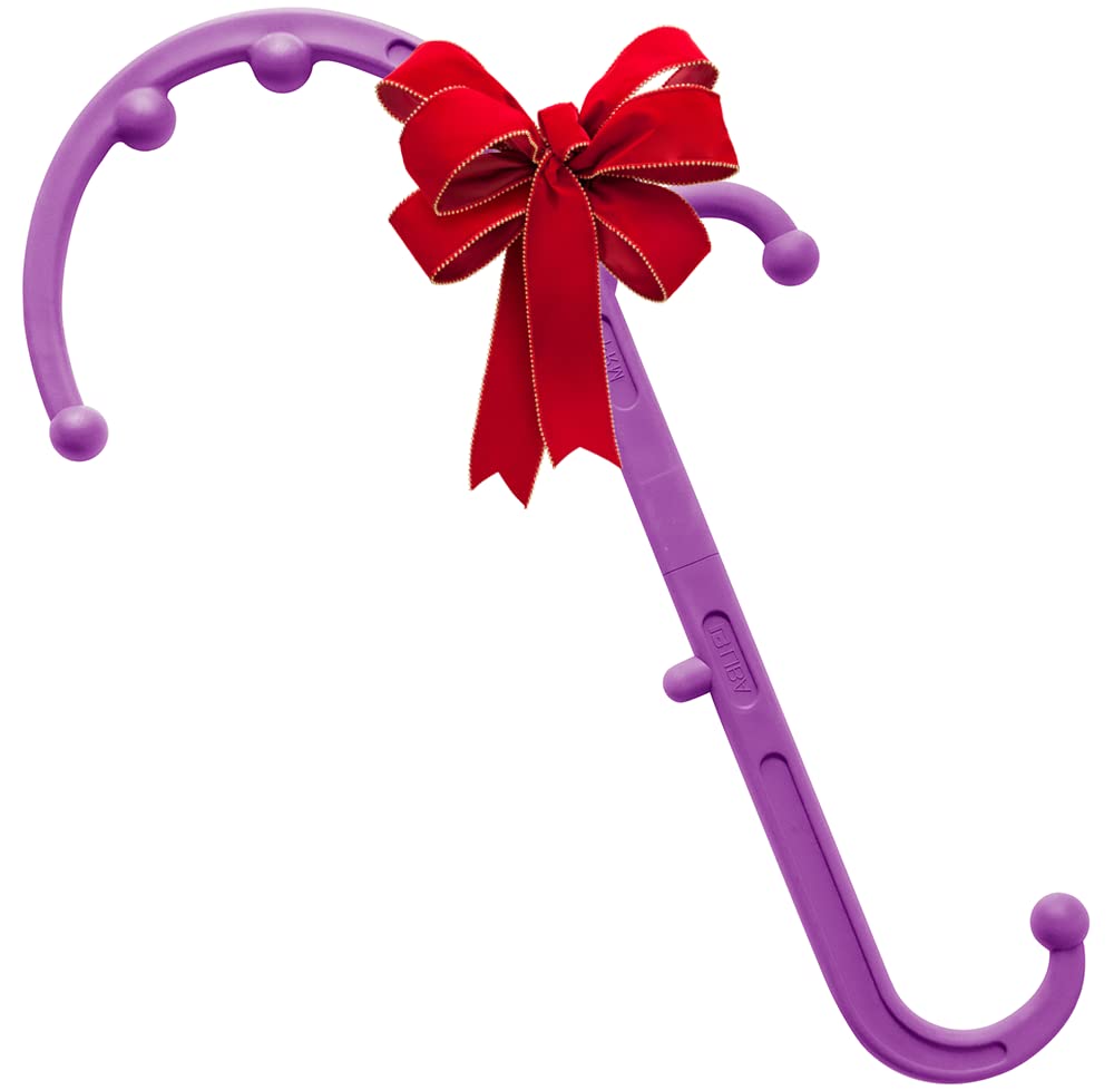 a purple toy with a red bow