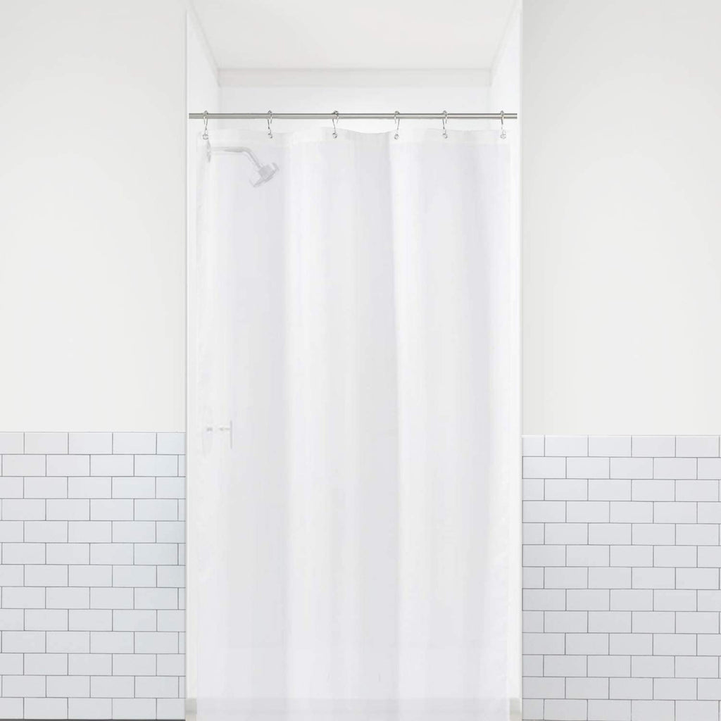 a shower curtain in a bathroom with text: '心'