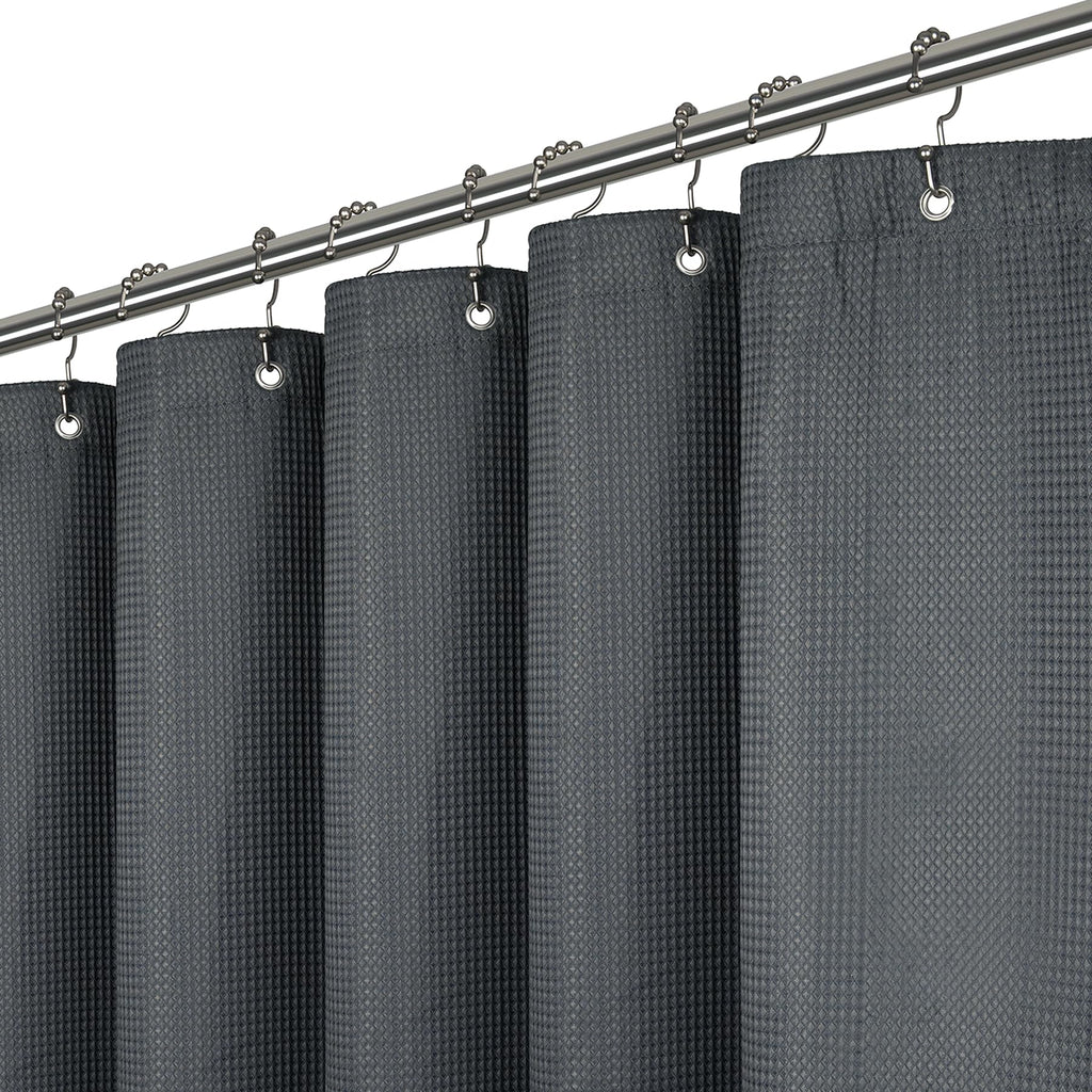 a grey curtain with rings attached to it